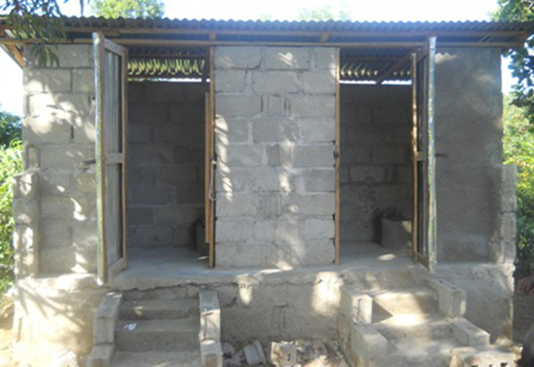 A new composting latrine is built for the children and teachers of Flower of Hope school.
